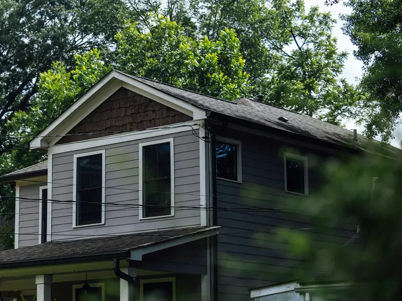 Gray two story house with clean siding
